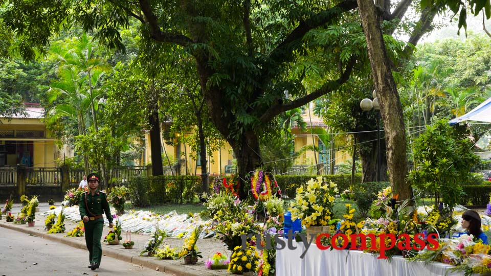 Floral tributes line the path to General Giap's Hanoi villa.
